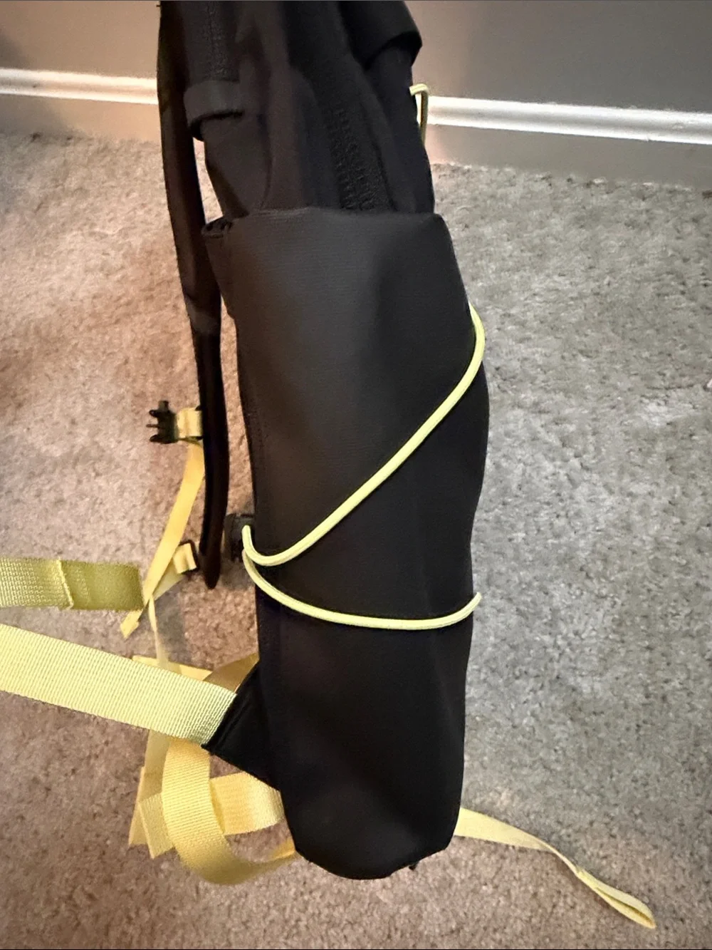 The North Face Black Backpack with Yellow Bungee and Straps